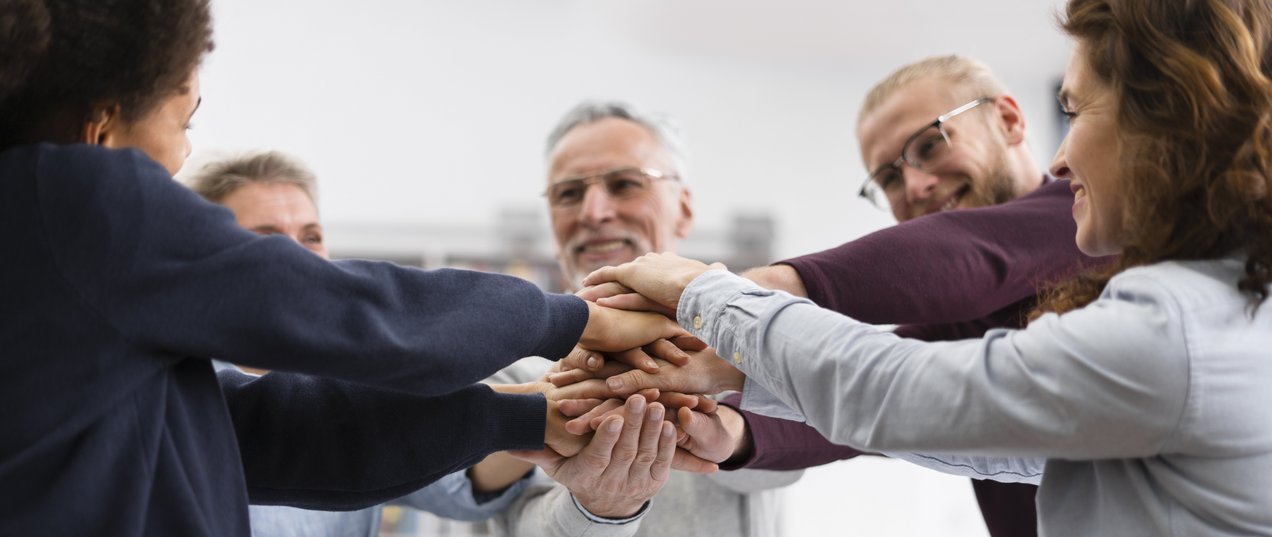 (c) Freepik close-up-people-holding-hands-together